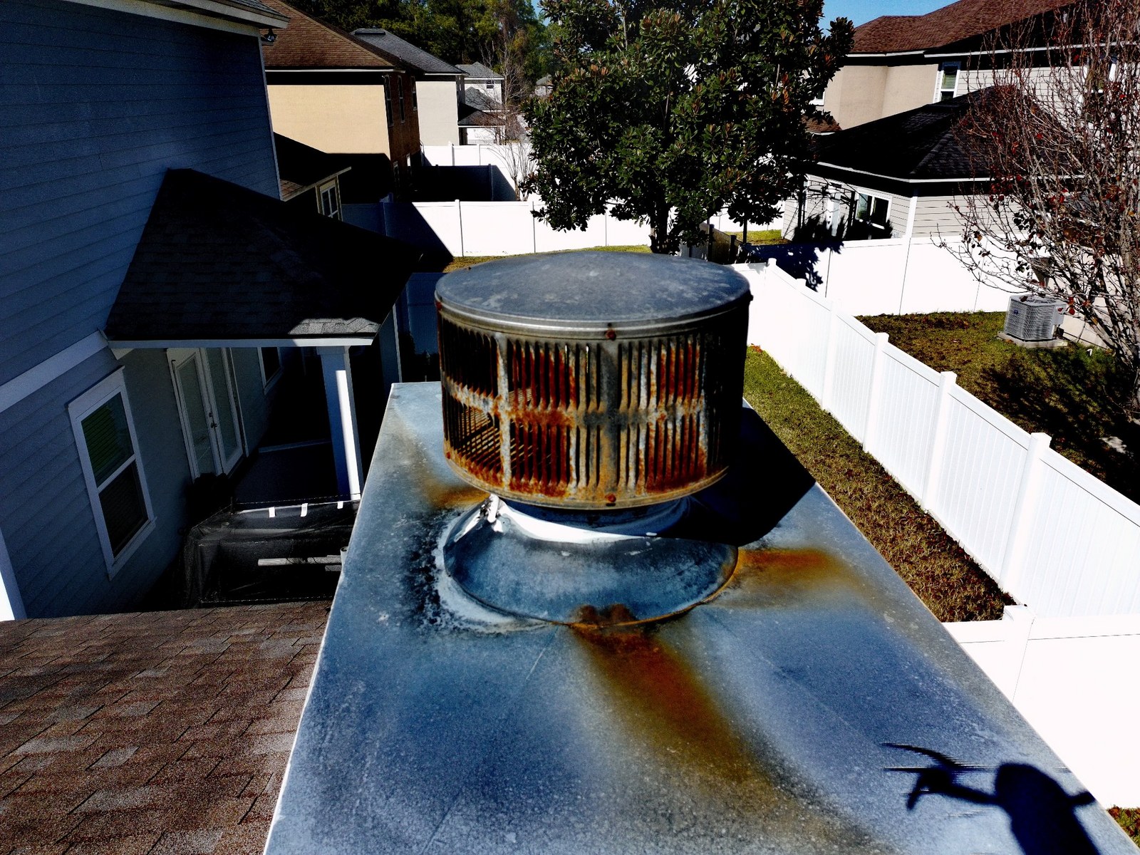 Before: rusted chimney metalwork repaired