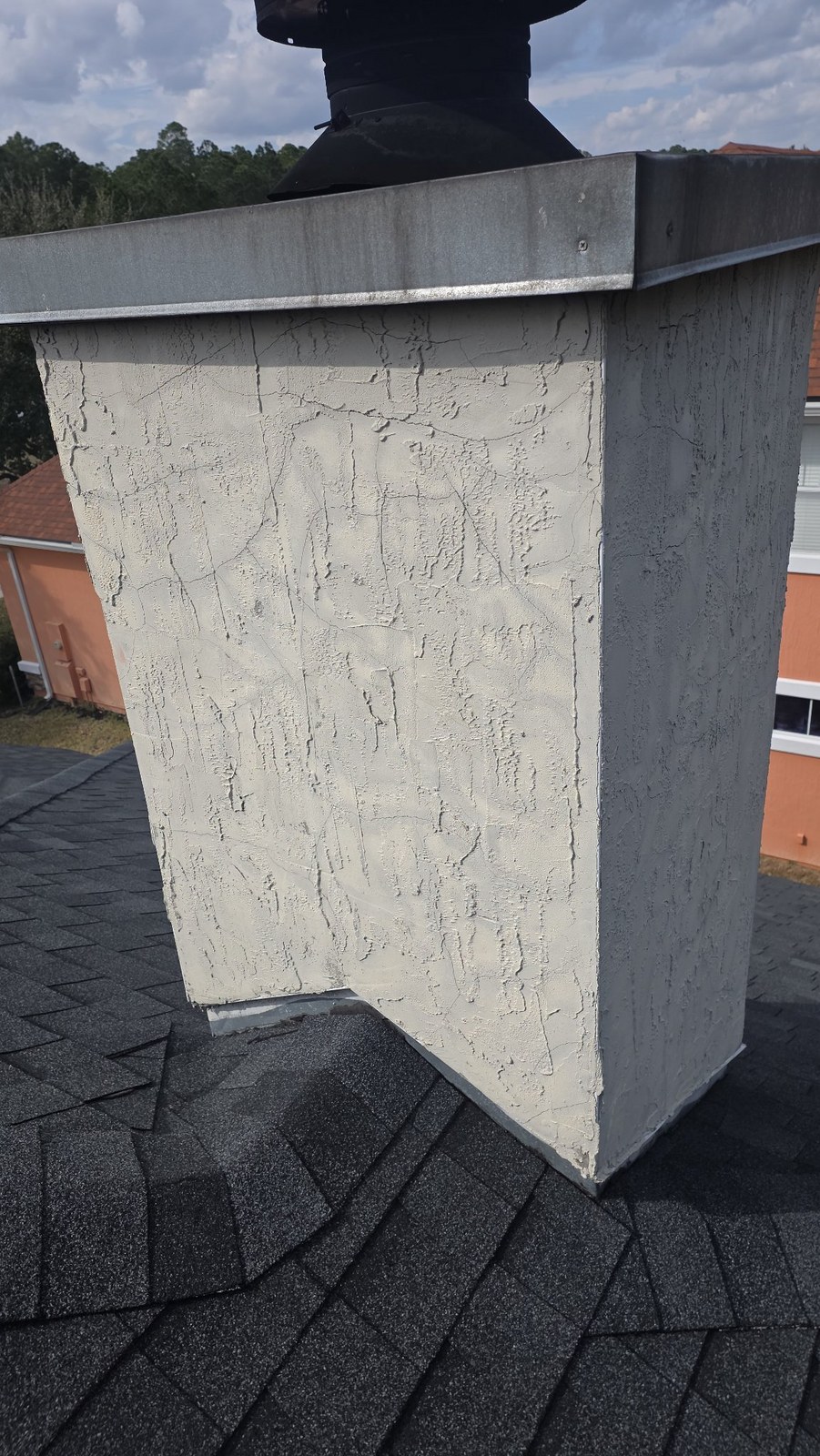 Before: cracked chimney stucco restored